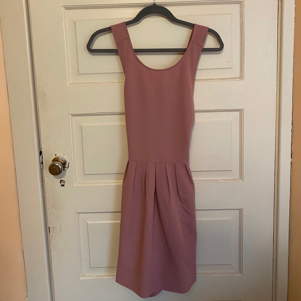 Dress with crossed back and pleated detail